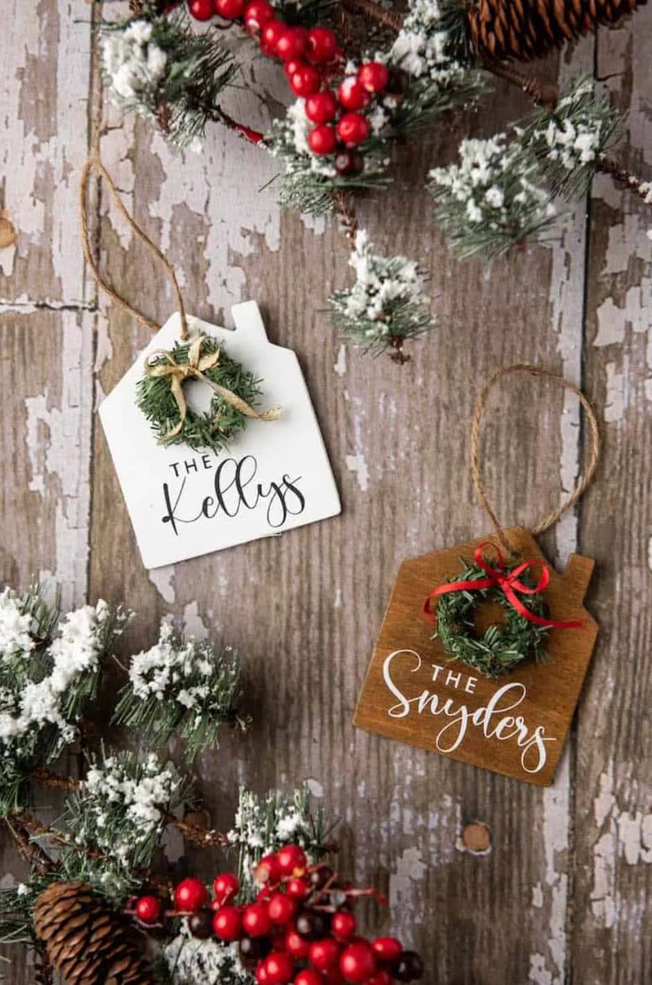 House ornaments with mini wreaths and hand-lettered family names.