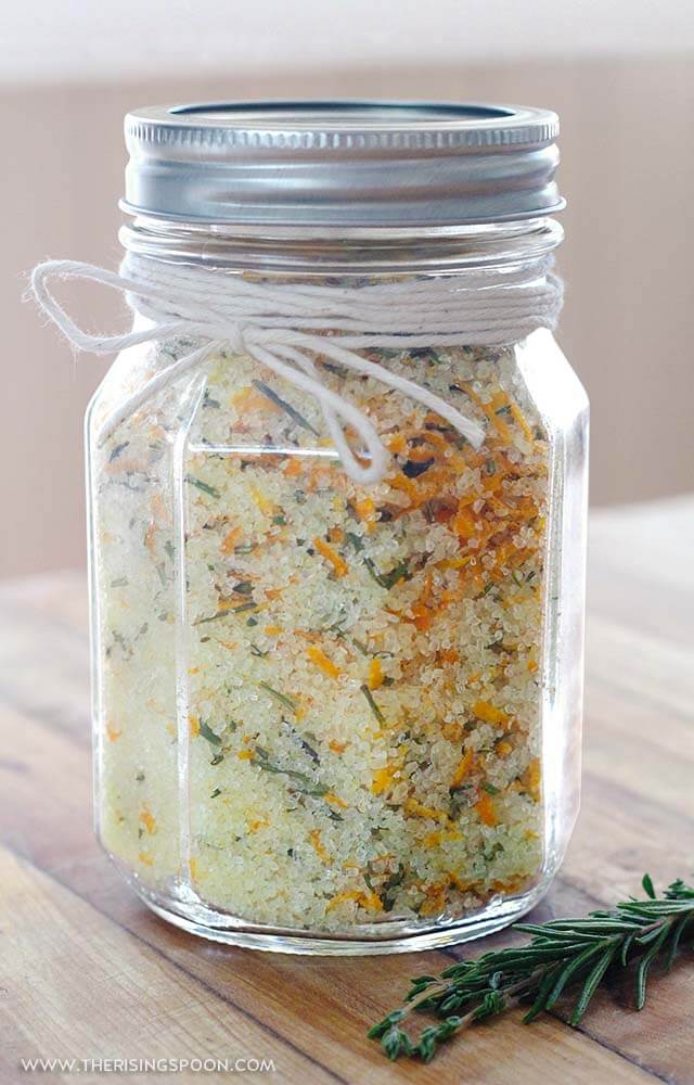 A jar of homemade rosemary, orange, and thyme flavored salt.