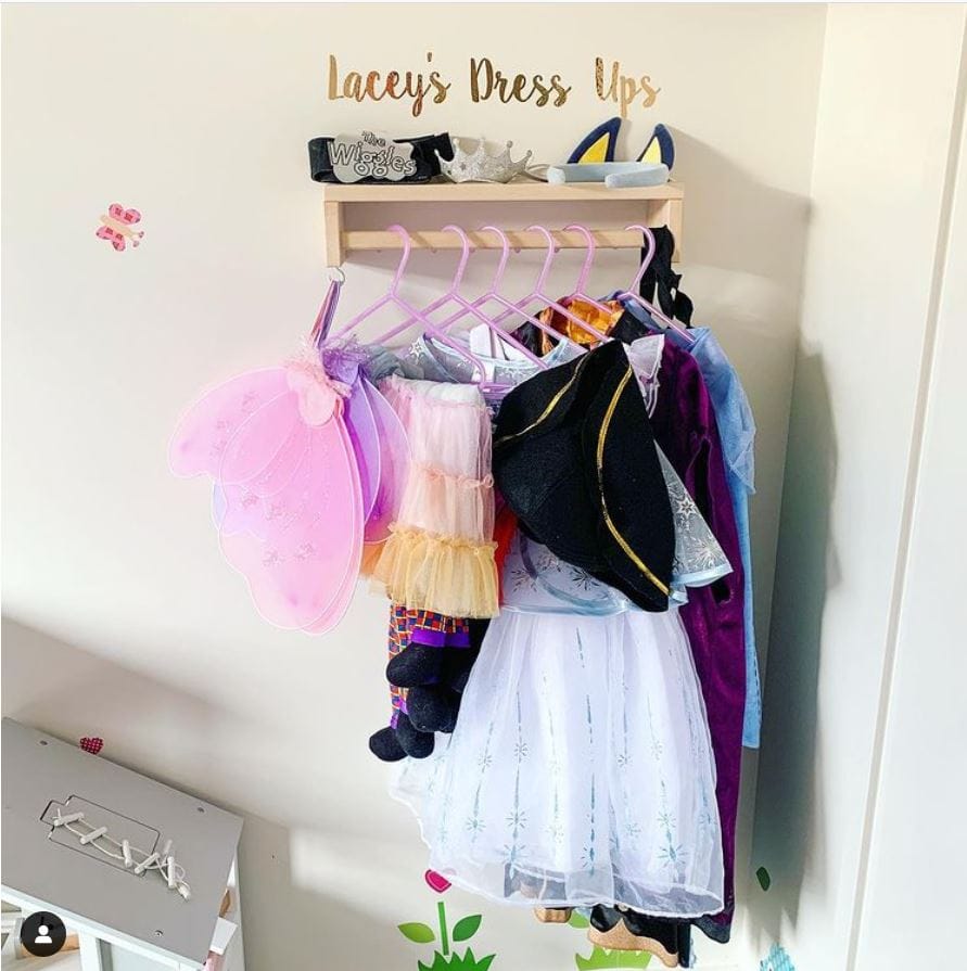 A dress-up corner made with an IKEA spice rack.