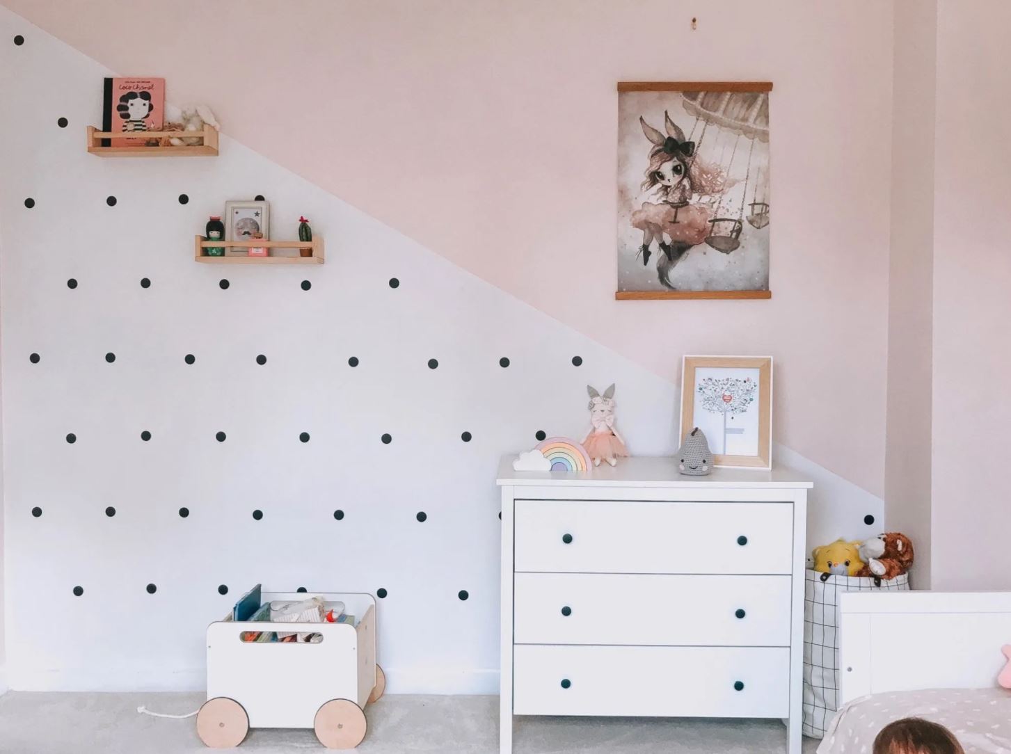 IKEA spice racks in a girl's pink bedroom.
