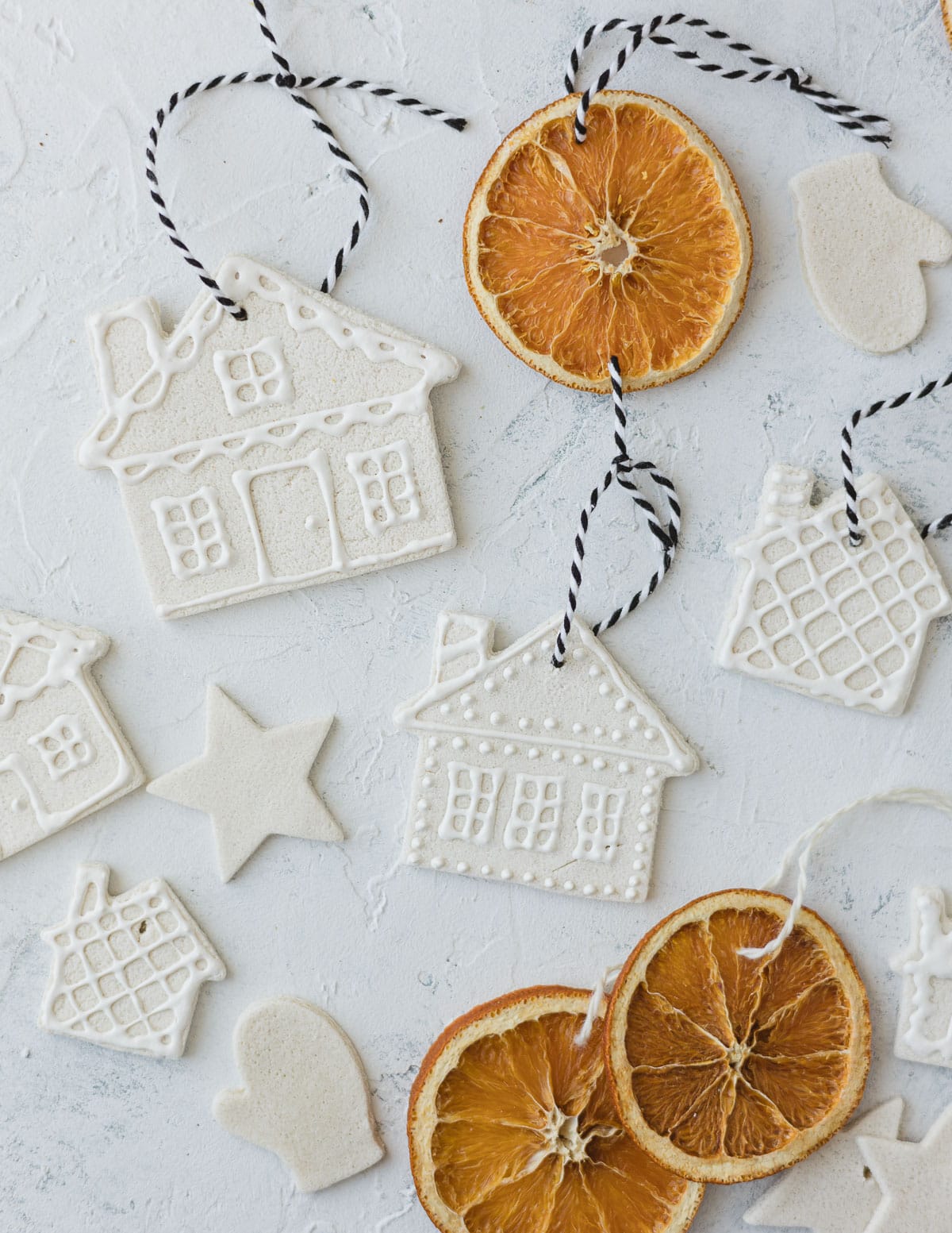 Homemade salt dough gingerbread house ornaments and orange slice ornaments.