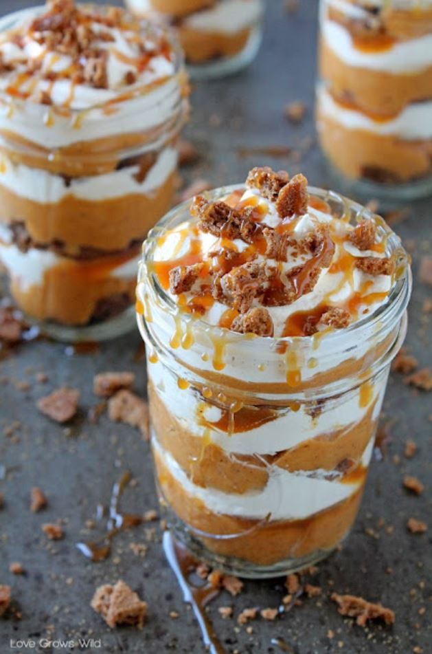 Mason jars filled with homemade salted caramel pumpkin parfaits.