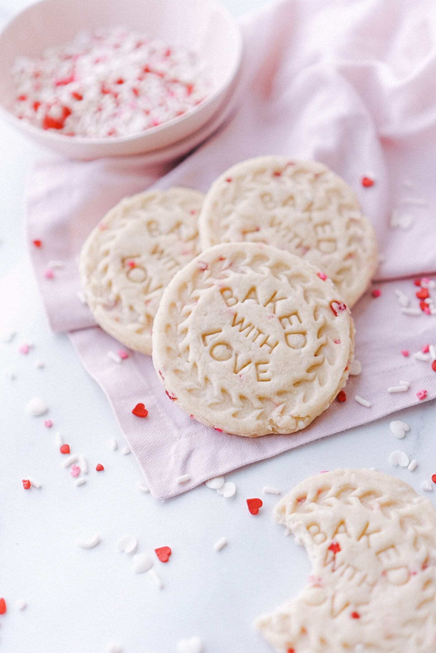 Valentine's Day sugar cookies stamped with the words, "Baked with Love".