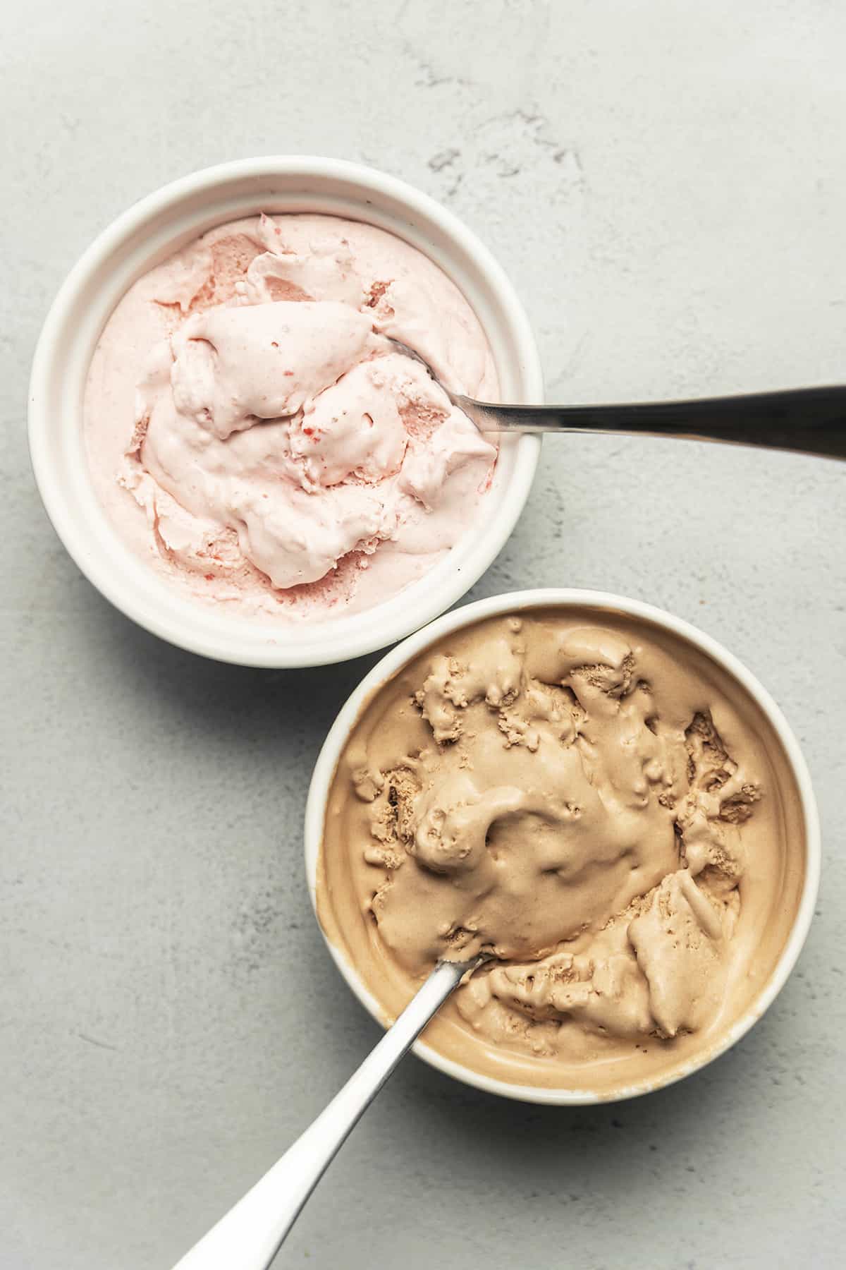 Two bowls of keto ice cream with spoons.