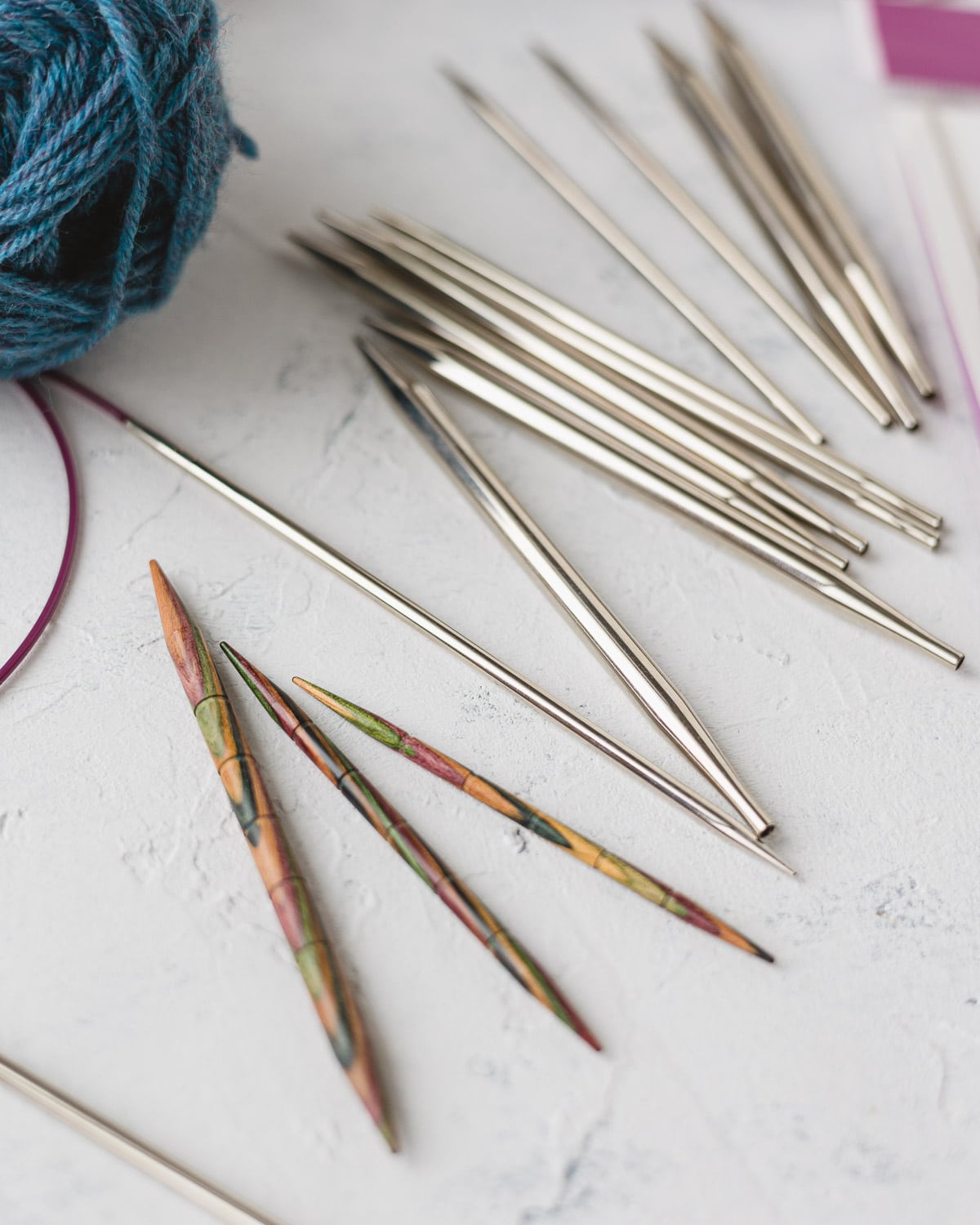 Three Knit Picks wooden cable needles for knitting.