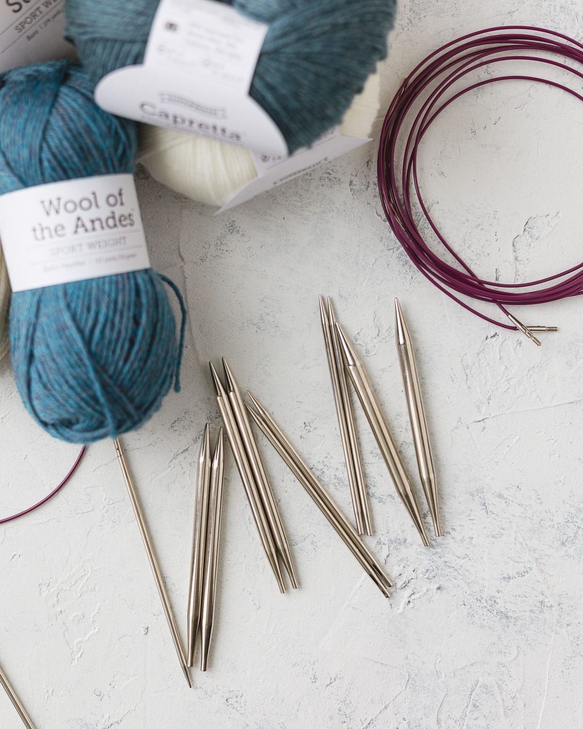 Nickel plated interchangeable knitting needle set, cables, and yarn.
