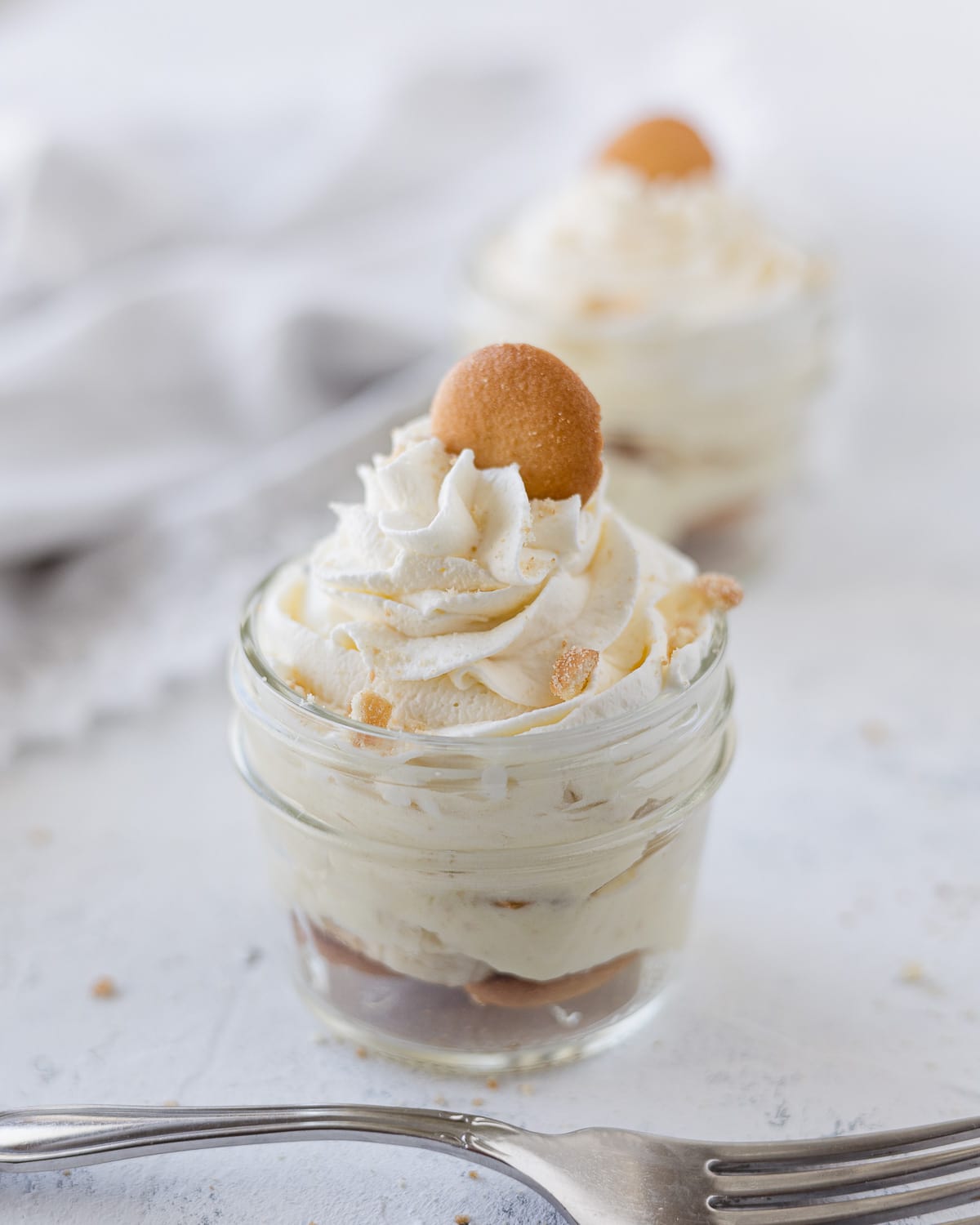 A small mason jar filled with no bake banana pudding.