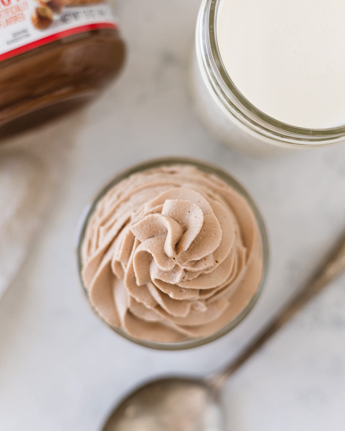 Swirls of chocolate-hazelnut whipped cream in a mason jar.