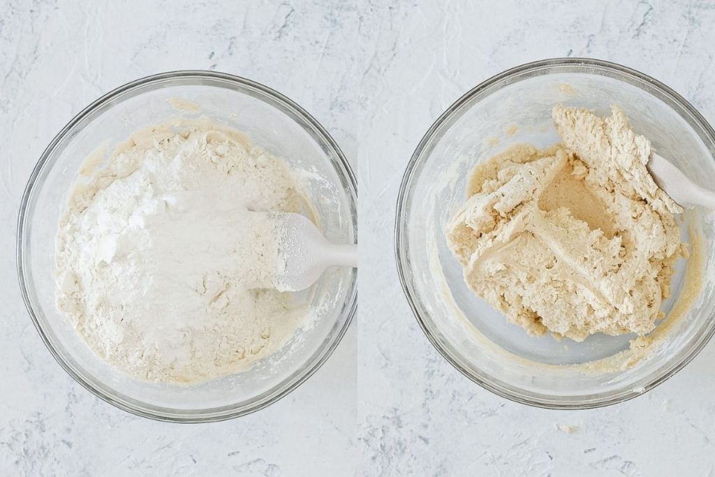 Folding flour into a bowl of cookie dough with a spatula.