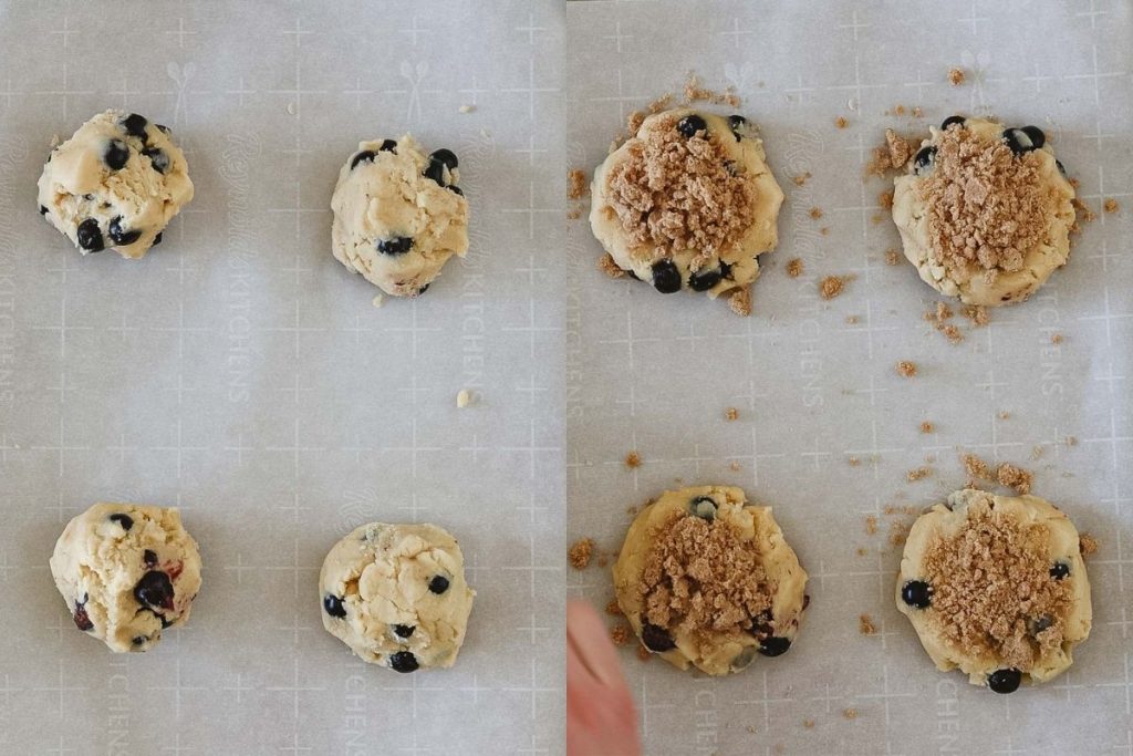 Forming cookie dough onto a parchment-lined cookie sheet and sprinkling with streusel topping.