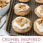 Large frosted cinnamon cookies on a baking tray and cooling rack with the words, "Crumbl Inspired Cinnamon Cookie Recipe".