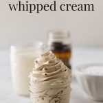 A spoonful of instant espresso powder in front of a small mason jar filled with coffee whipped cream with the words, "Coffee-Flavored Whipped Cream".