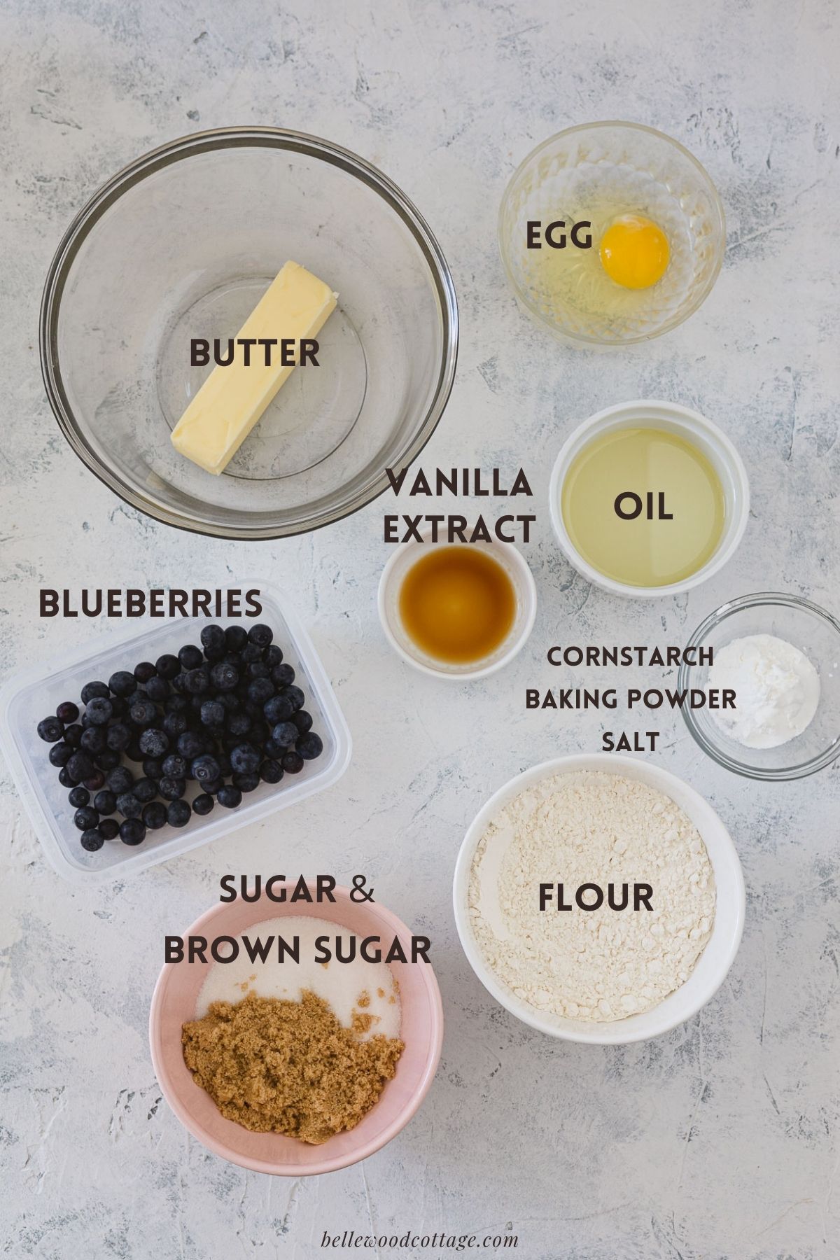 Labeled ingredients for blueberry muffin cookies: butter, egg, oil, vanilla extract, blueberries, cornstarch, baking powder, salt, sugar and brown sugar.