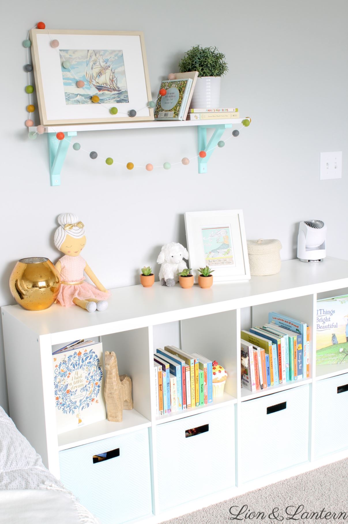 IKEA Kallax kids bookshelf with colorful board books.