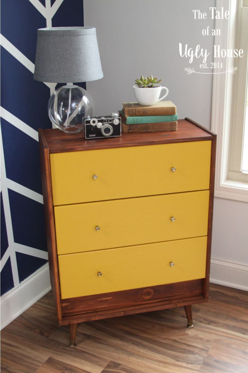 An IKEA hack of the RAST dresser painted yellow and with legs added.