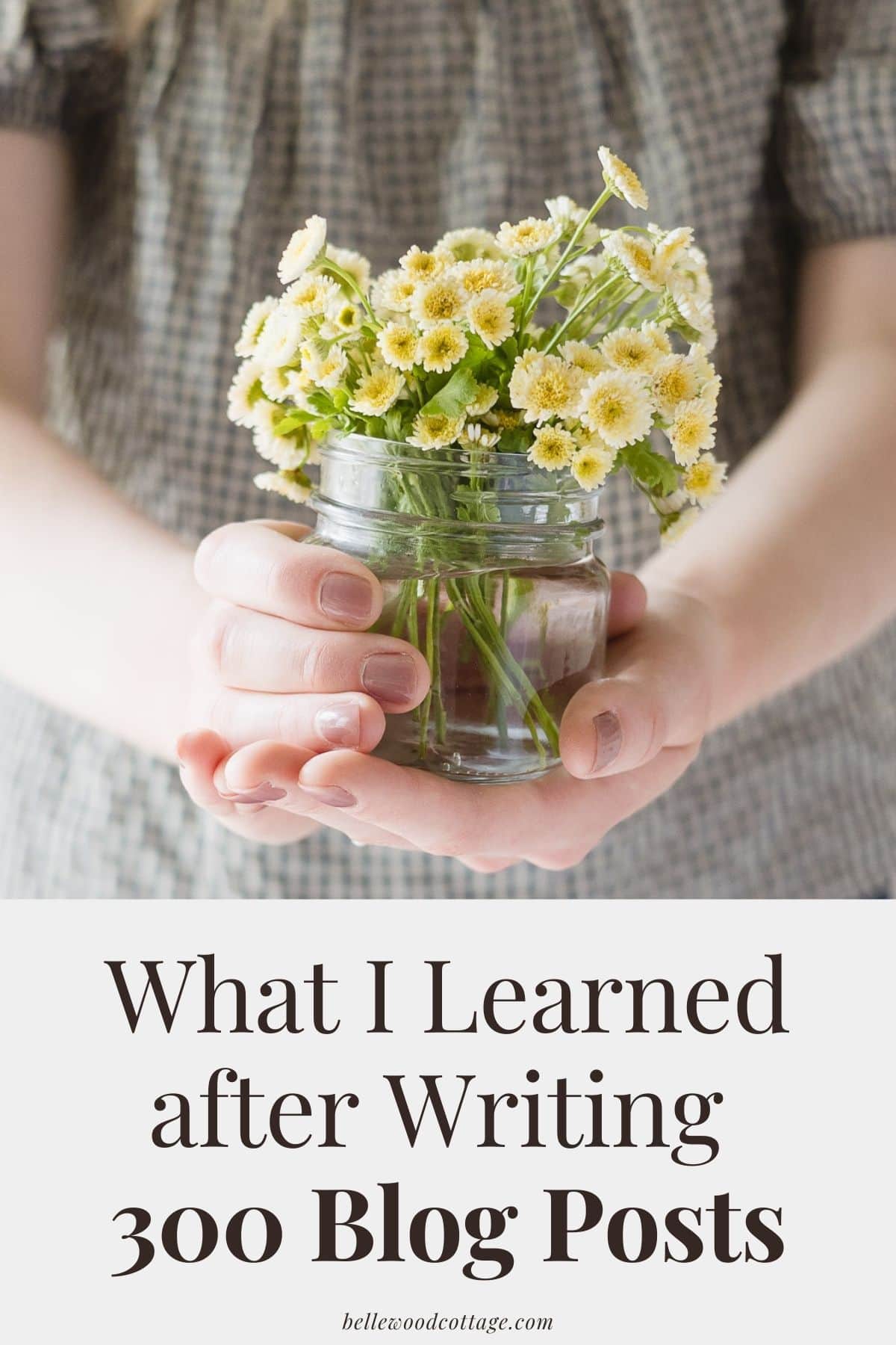 Hands holding a jar of flowers with the words, "What I Learned After Writing 300 Blog Posts"