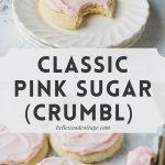 A pink-frosted sugar with a bite removed and a tray of more cookies with the words, "Crumbl Classic; Classic Pink Sugar (Crumbl)"