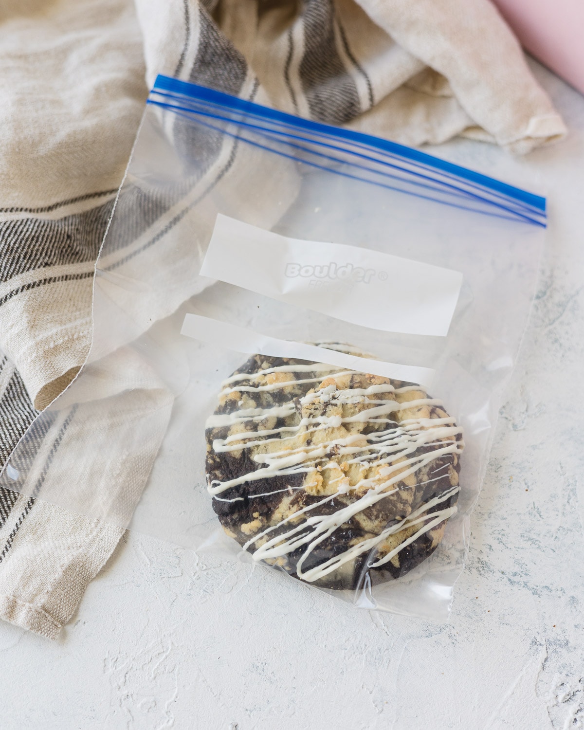 A cookies and cream cookie in a quart size zipper top freezer bag.