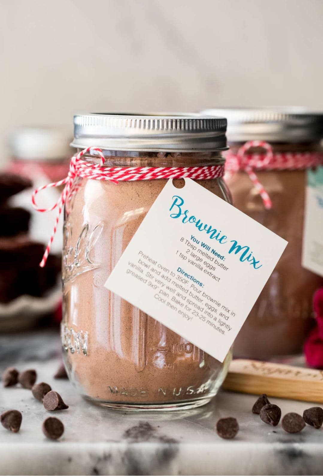 A mason jar full of brownie mix with a tag with directions.