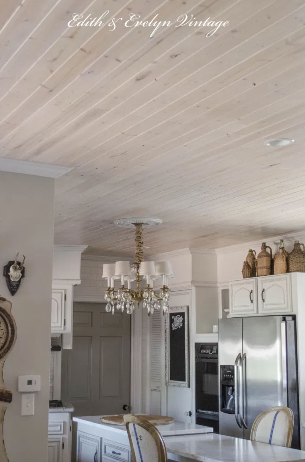 Rustic planked ceiling in a French country kitchen.