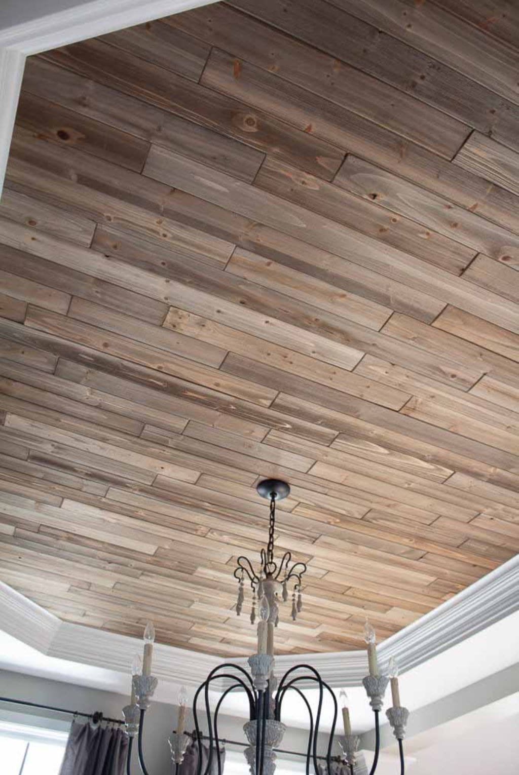 A ceiling planked with rustic wood planks.