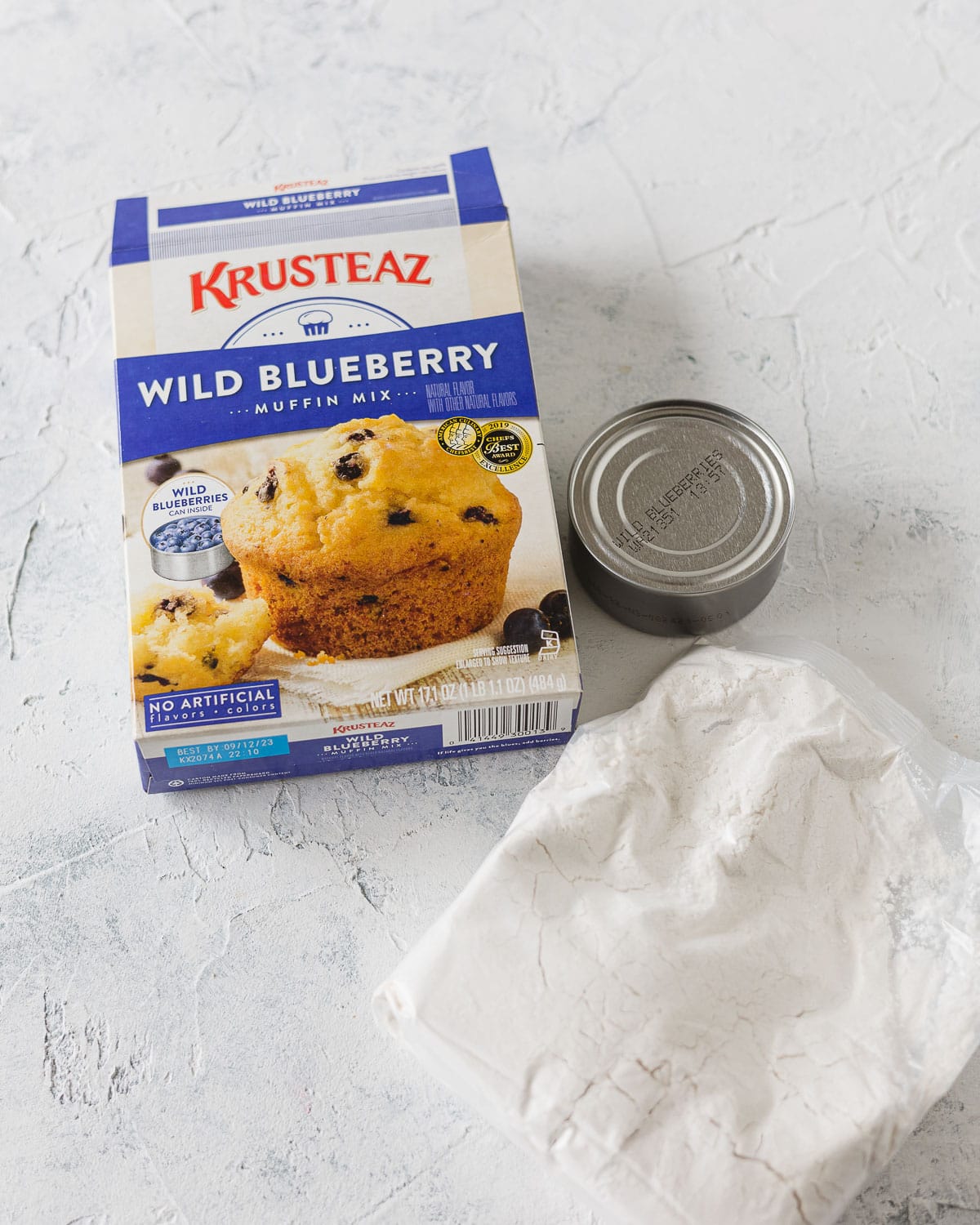 A box of blueberry muffin mix and the small can of blueberries that comes inside.