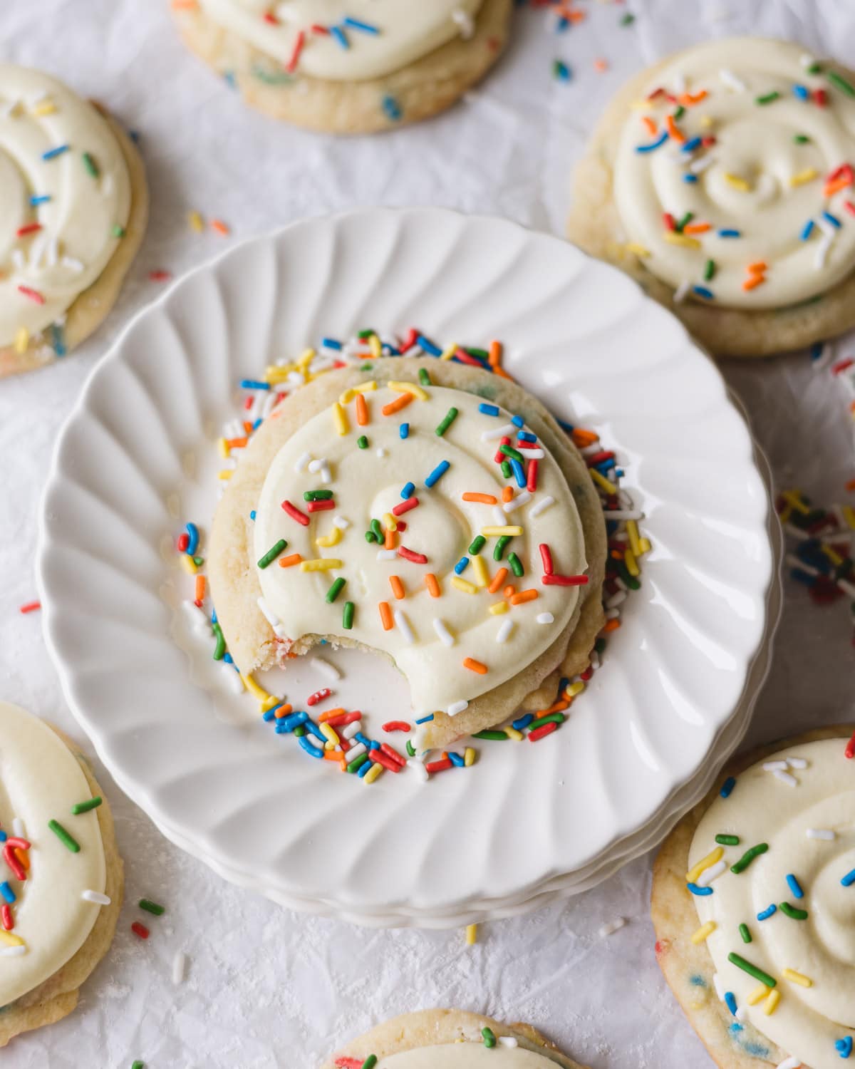 Funfetti cookies with cream cheese frosting and more sprinkles on top.