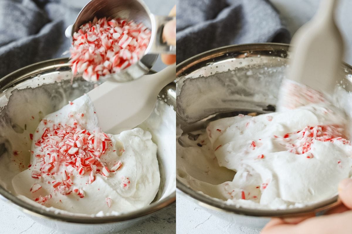 Sprinkling candy cane pieces into a bowl of whipped cream and folding them in with a spatula.