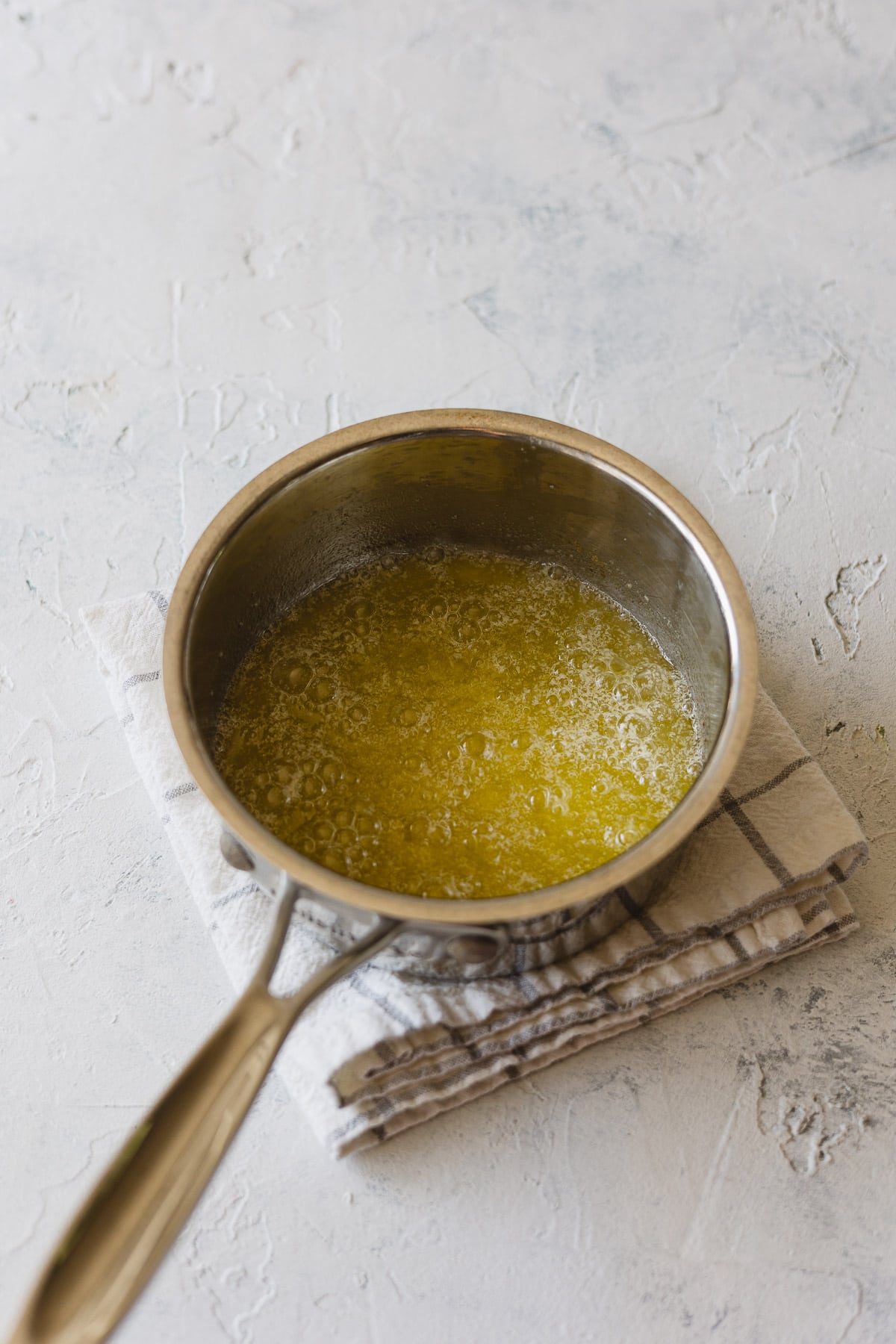A saucepan with bubbling melted butter.