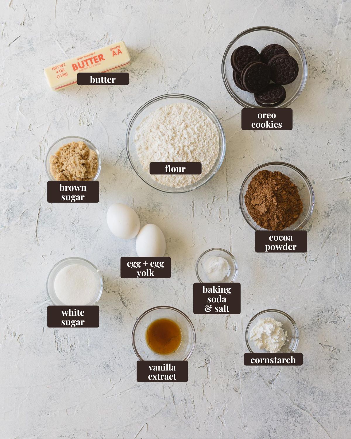 Labeled ingredients for French Silk Pie Cookies: butter, oreo cookies, cocoa powder, cornstarch, vanilla extract, white sugar, brown sugar, butter, flour, baking soda & salt, and egg + egg yolk.
