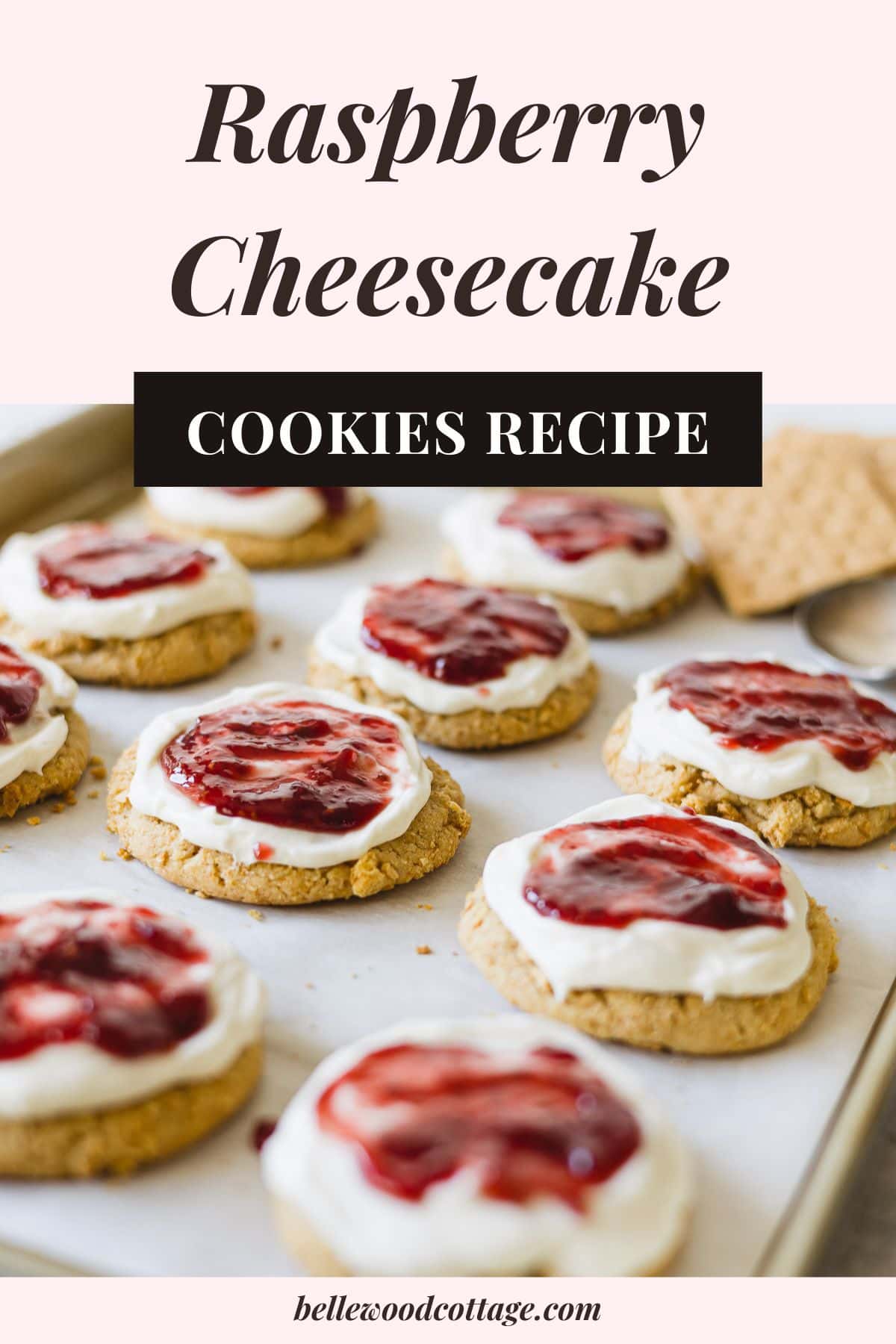 Graham Cracker Cookies with Cheesecake Frosting and Raspberry Jam with the words, "Raspberry Cheesecake Cookies."