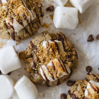 Graham cracker cookies with chocolate pieces, marshmallows, and graham cracker crumbles.