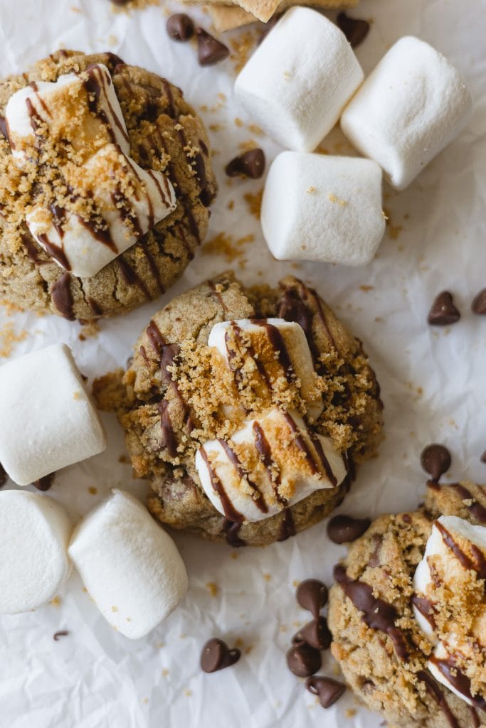 Graham cracker cookies with chocolate pieces, marshmallows, and graham cracker crumbles.