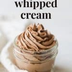 Chocolate whipped cream piped into a small mason jar with the words, "Chocolate Whipped Cream."