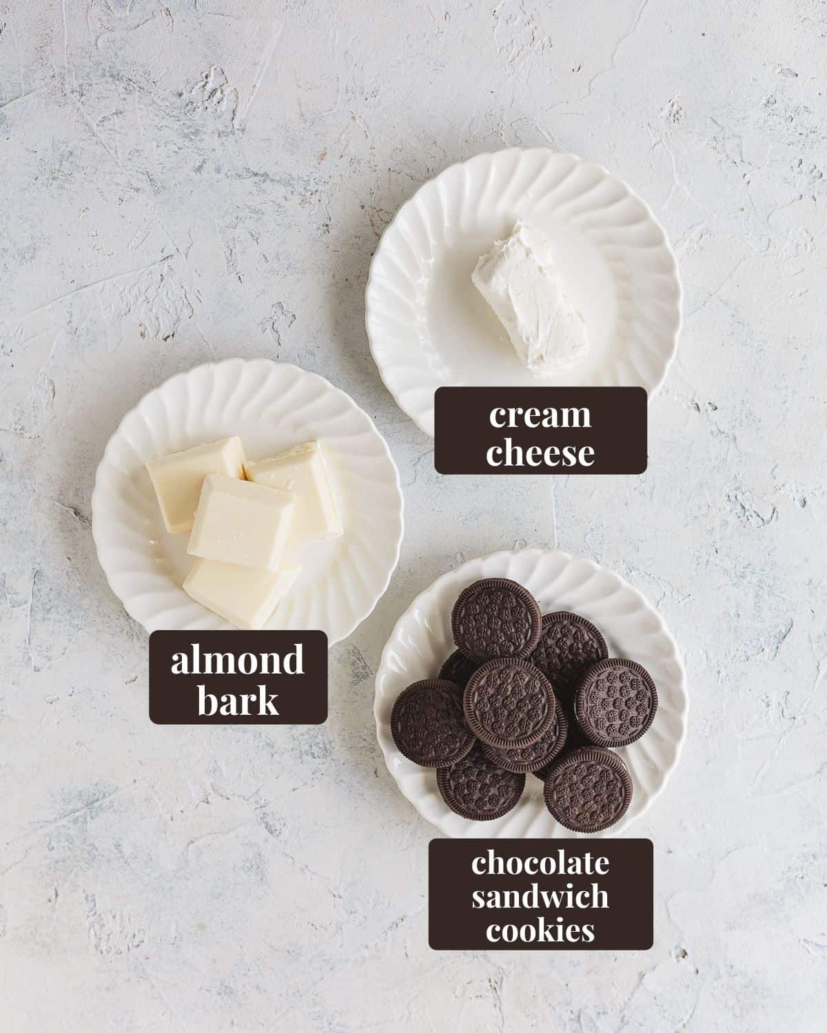 Labeled ingredients for Small Batch Oreo Balls: cream cheese, almond bark, and chocolate sandwich cookies.