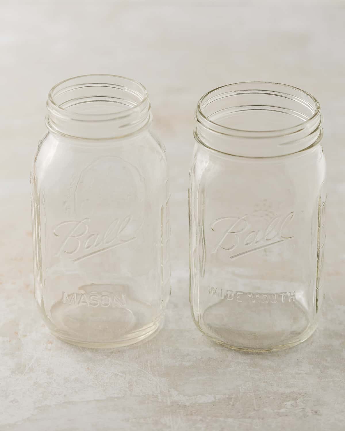 A regular mouth 32-ounce mason jar and a wide-mouth 32-ounce mason jar.