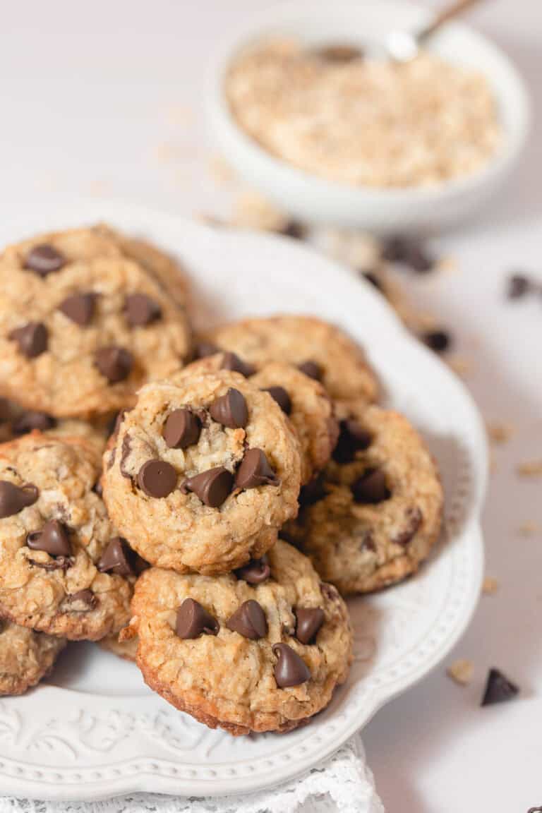 A ceramic plate filled with Coconut Oatmeal Chocolate Chip cookies.