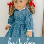 A vintage Pleasant Company 1991 Kirsten doll with the words, "How to Clean a Thrifted Doll".